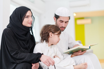 Wall Mural - muslim family reading Quran and praying at home