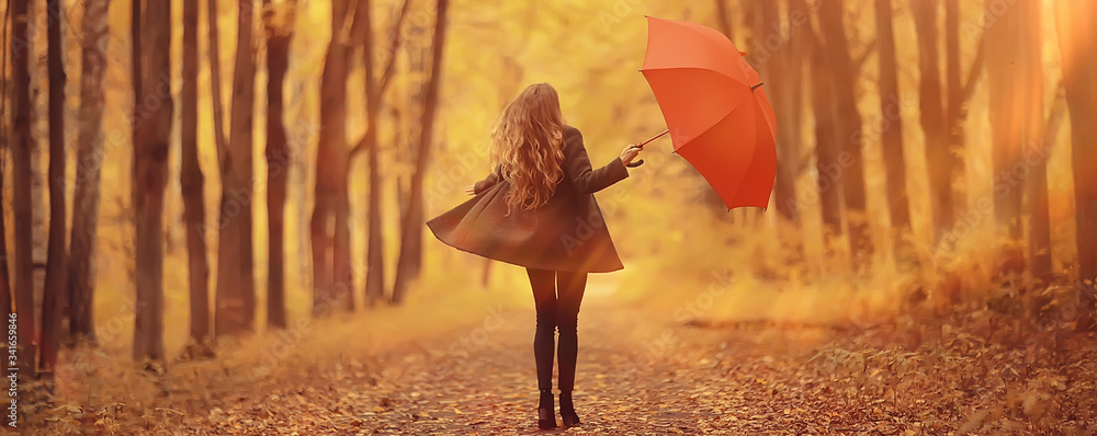 young woman dancing in an autumn park with an umbrella, spinning and holding an umbrella, autumn walk in a yellow October park - obrazy, fototapety, plakaty 