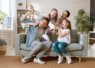 Wall Mural - Two children with mother and father.