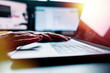 © alvaro - a closeup image of a woman working and typing on laptop computer keyboard