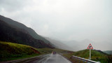 Fototapeta Tęcza - Rainy road in Altai Mountains, Russia