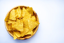 A Bowl Of Corn Chips Nachos Close-up On A White Background. Place For Copy Space