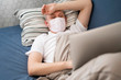 © FreepikCompany - Sick person wearing a mask indoors