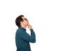 © 1STunningART - Side view of young businessman keeps hand under chin, thoughtful gesture, isolated over white background with copy space. Business worker wears glasses looking up focused, thinking of great ideas.