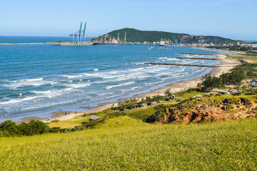 Wall Mural - Aerial view of Porto beach, in Imbituba - SC. Beautiful beach in Imbituba city, Santa Catarina, Brazil