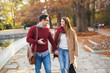 © Jelena - Couple in the park holding hands while walking.
