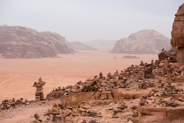 wish pyramids, stone pyramids against the backdrop of a desolate landscape. Shot in Jordan