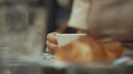 Wall Mural - Young girl having breakfast close-up