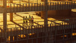 © Gorodenkoff - Aerial View: Diverse Team of Specialists Inspect Commercial, Industrial Building / Skyscraper Formwork Construction Site. Real Estate Project Lead by Civil Engineer, Investor, Architect and Worker