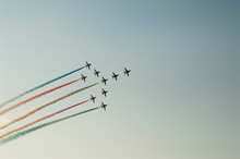 Plane In The Sky Splashing Colors During Air Show Performance During An Air Show In Dubai