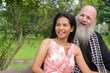 © Ranta Images - Happy mature multi ethnic couple together and in love at the park outdoors