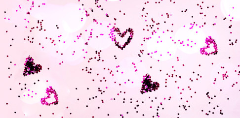 Wall Mural - Confetti and stars on pink pastel background. Mothers Day concept. Festive backdrop for package and projects