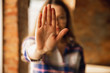 © master1305 - Close up view of young woman making stop gesture with her hand. Cropped isolated portrait of caucasian female model. Showing her position, rejecting, defending. Copyspace for advertising.