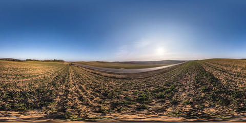 Wall Mural - full seamless spherical hdri panorama 360 degrees angle view on among fields in spring evening with 