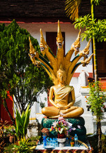 Gold Buddhist Statue Outside Wat Mai Suwannaphumaham, Luang Prabang, Loas, Southeast Asia