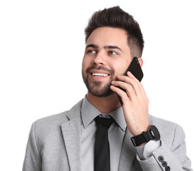 Poster - Young businessman talking on smartphone against white background