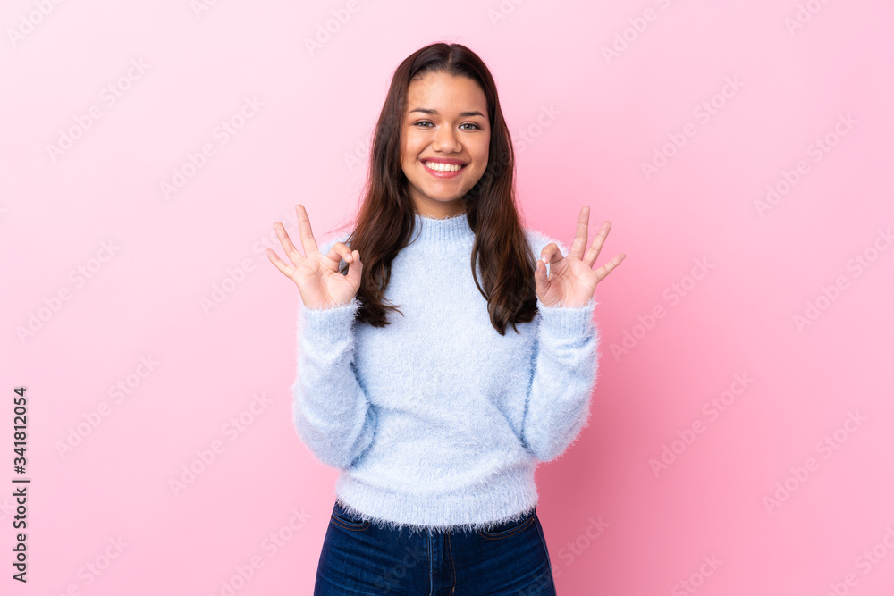 Young Colombian Girl Over Isolated Pink Background Showing An Ok Sign With Fingers Stock Gamesageddon
