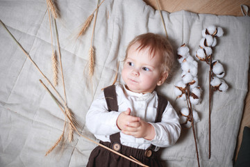 a one-year-old boy in a rustic style