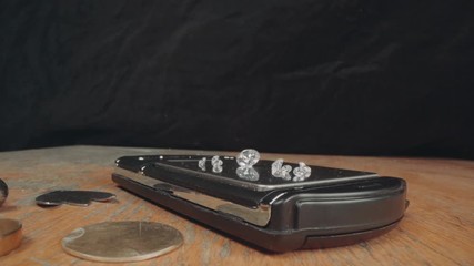 Wall Mural - Close-up of a goldsmith's work table on which they are supported: high-quality diamonds, and precision tools for producing luxury jewelery. Concept of: tradition, luxury, jewelry.