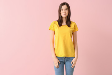 Poster - Woman in stylish t-shirt on color background