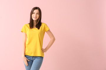 Poster - Woman in stylish t-shirt on color background