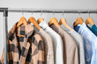 © Pixel-Shot - Rack with clothes on light background