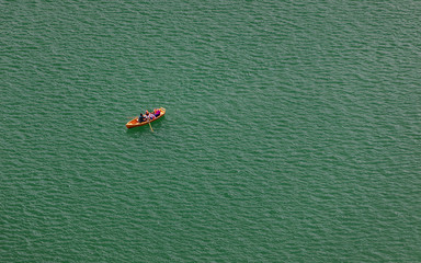 Wall Mural - Lake Bled, Slovenia. Top view of a boat sailing in the lake. Bled lake is the most famous lake in Slovenia. Bled, Slovenia.