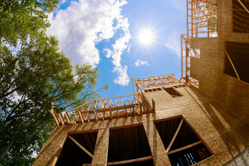 New construction of a house framed of a under construction building