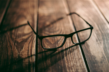 Glasses for sight and vision correction and protection from computer on the wooden table