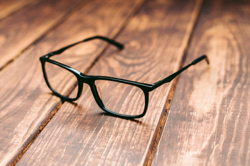 Canvas Print - Glasses for sight and vision correction and protection from computer on the wooden table