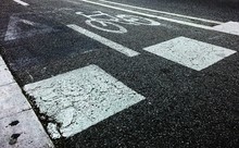 High Angle View Of Bicycle Lane Sign On Street