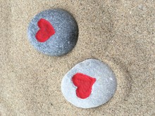 High Angle View Of Red Heart Shapes Rocks At Beach
