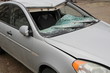 © Stanislav - Broken windshield. A broken silver car after an accident on the road. Transport security concept.