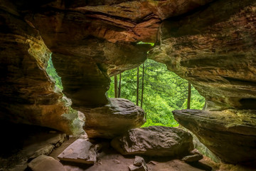 In Hocking Hills State Park, Ohio, Rock House is a twenty-five foot tall cave, on the side of a tall sandstone cliff, with seven natural Gothic-arched windows lighting its two hundred foot length.