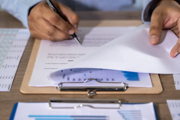 businessman working using a calculator finance accounting concept achievement to balance man assistant accounting.