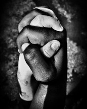White And Black Children Hand Holding Eachother