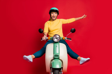 Canvas Print - Portrait of her she nice attractive overjoyed carefree crazy girlish cheerful cheery girl riding moped having fun free time isolated on bright vivid shine vibrant red color background