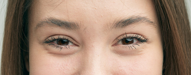 Smiling eyes of a beautiful emotional girl close-up.