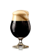 Dark Beer With Froth N A Tulip Glass, Close Up 