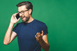 © denis_vermenko - Attractive young man with smartphone on color background