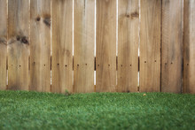 Wooden Fence On Grassy Field