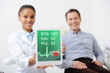 © LIGHTFIELD STUDIOS - selective focus of cheerful african american dentist holding digital tablet with heartbeat rate and pulse on screen near happy patient