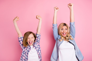 Sticker - Portrait of delighted crazy mom her daughter hear incredible corona virus victory news raise fists scream yes wear casual denim jeans checkered plaid shirt isolated pastel color background