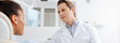 © LIGHTFIELD STUDIOS - panoramic shot of dentist looking at african american patient