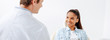 © LIGHTFIELD STUDIOS - panoramic shot of happy african american woman in braces looking at orthodontist in clinic