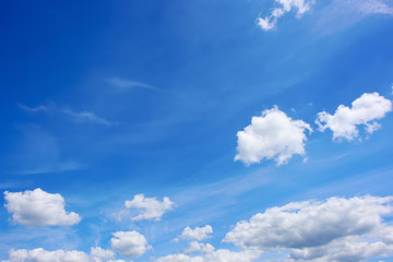 beautiful blue summer sky with fluffy clouds as a background