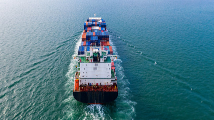 Aerial view container cargo ship, import export commerce global business trade logistic and transportation of worldwide by container cargo ship boat in the open sea, Freight shipping maritime.