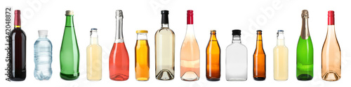 Fotografía Set of bottles with different drinks on white background