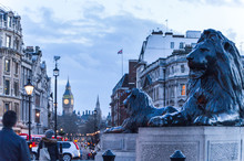 Rear View Of People By Lion Statues At Trafalgar Square Against Big Ben