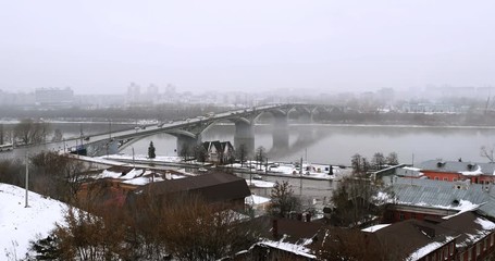 Sticker - Nizhny Novgorod, Russia. Aerial view of historical buildings in popular touristic city Nizhny Novgorod, Russia with cloudy sky in winter. Cars at the bridge over river